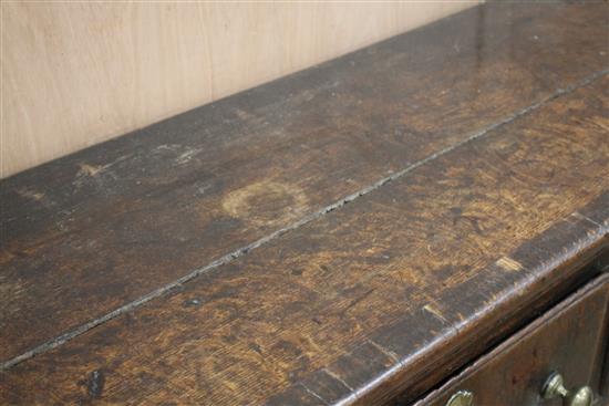 A George III banded oak low dresser, W.188cm D.51cm H.77cm